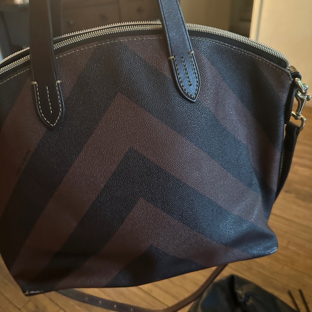 Dooney & Bourke bag. Small scratch on bottom corner. Seen on picture